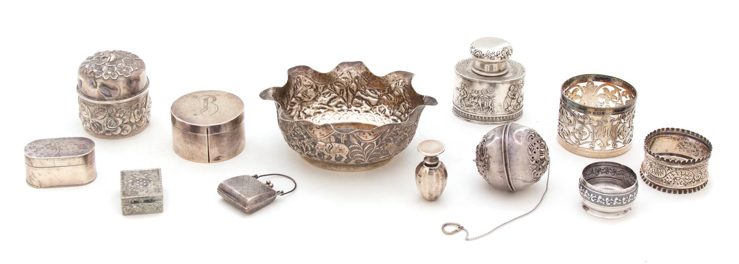A Miscellaneous Collection of Silver, Various Makers, including 3 vinaigrettes, 2 napkin rings, 2 covered boxes, a locket, a tea strain