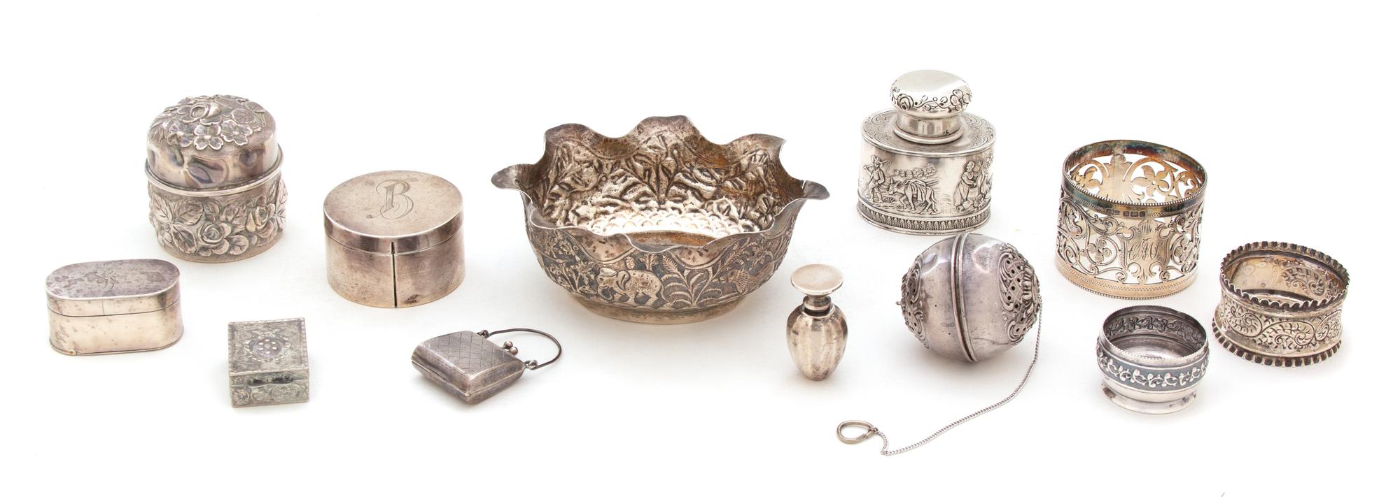 A Miscellaneous Collection of Silver, Various Makers, including 3 vinaigrettes, 2 napkin rings, 2 covered boxes, a locket, a tea strain