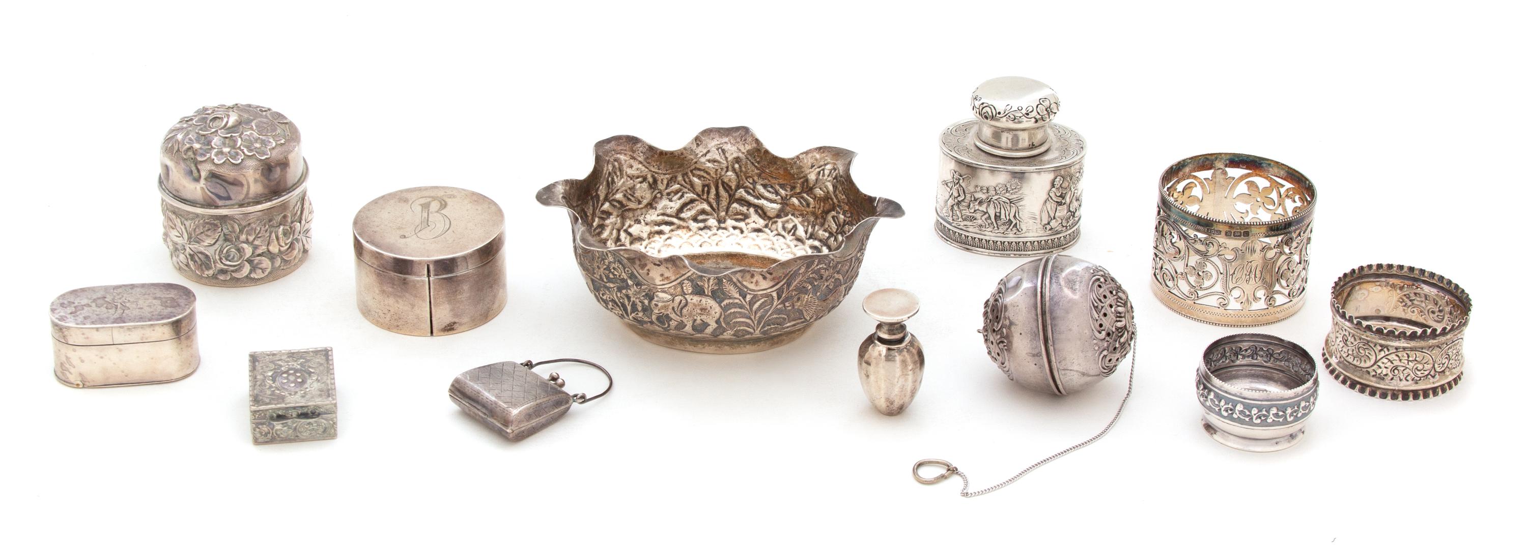 A Miscellaneous Collection of Silver, Various Makers, including 3 vinaigrettes, 2 napkin rings, 2 covered boxes, a locket, a tea strain