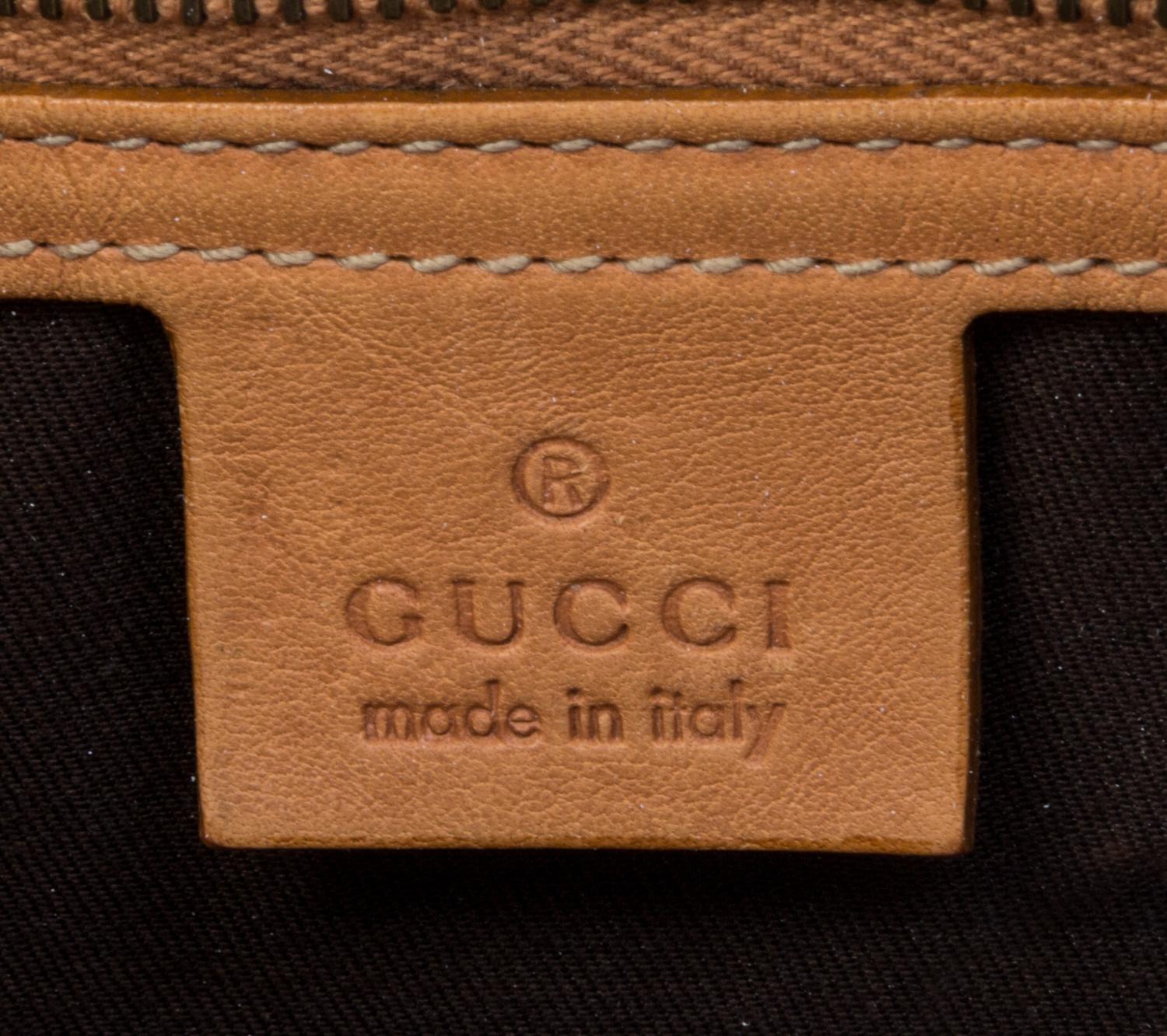 A Gucci Striped Woven Bag, 14" x 12" x 2".