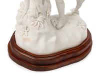 A Continental Marble Figural Group on a Wood Base