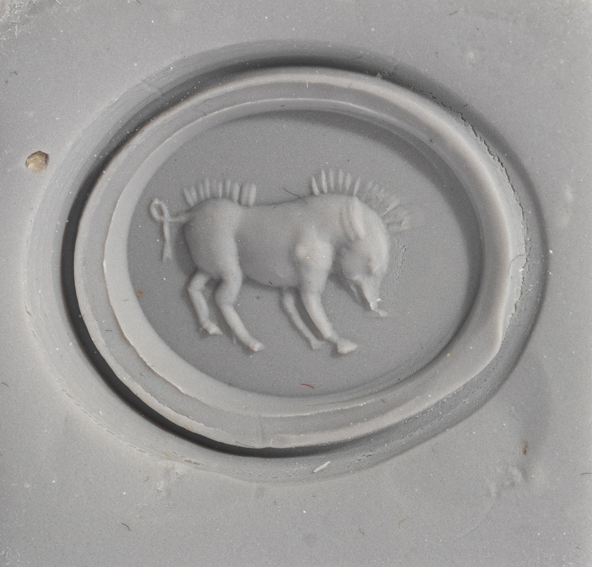 A Roman Red Jasper Ring Stone with a Boar — Set in a gold ring