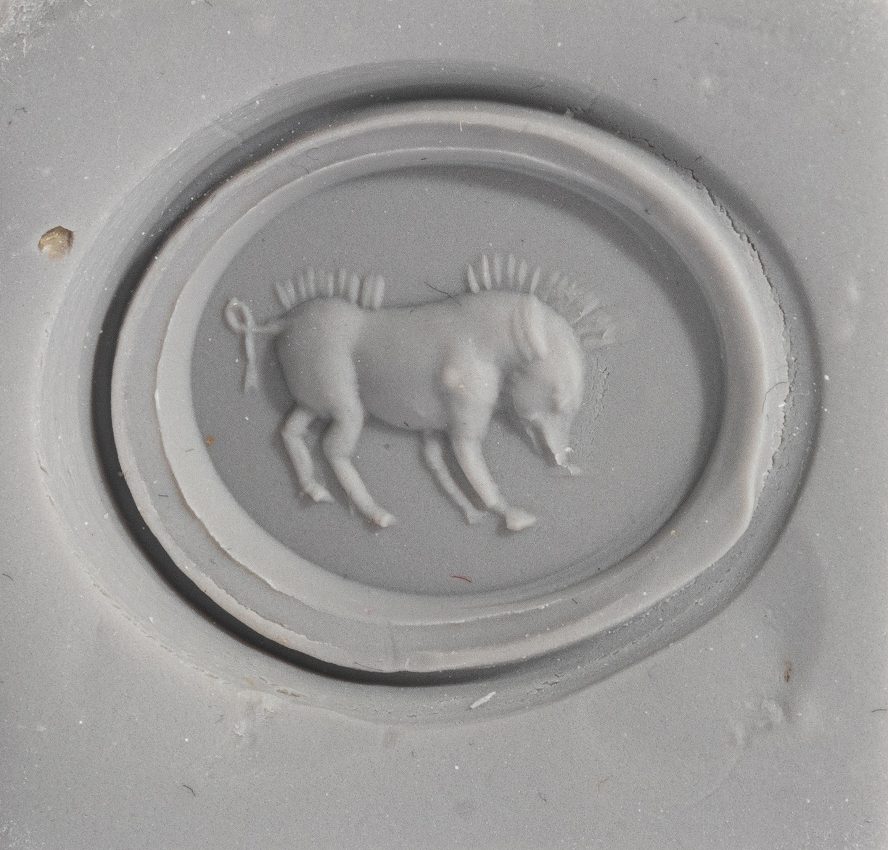 A Roman Red Jasper Ring Stone with a Boar — Set in a gold ring