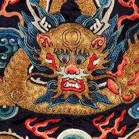 A Chinese Black Ground Embroidered Silk 'Dragon' Court Robe, Chaofugua, 19th Century 清晚期 黑緞地綉云龍紋朝服褂