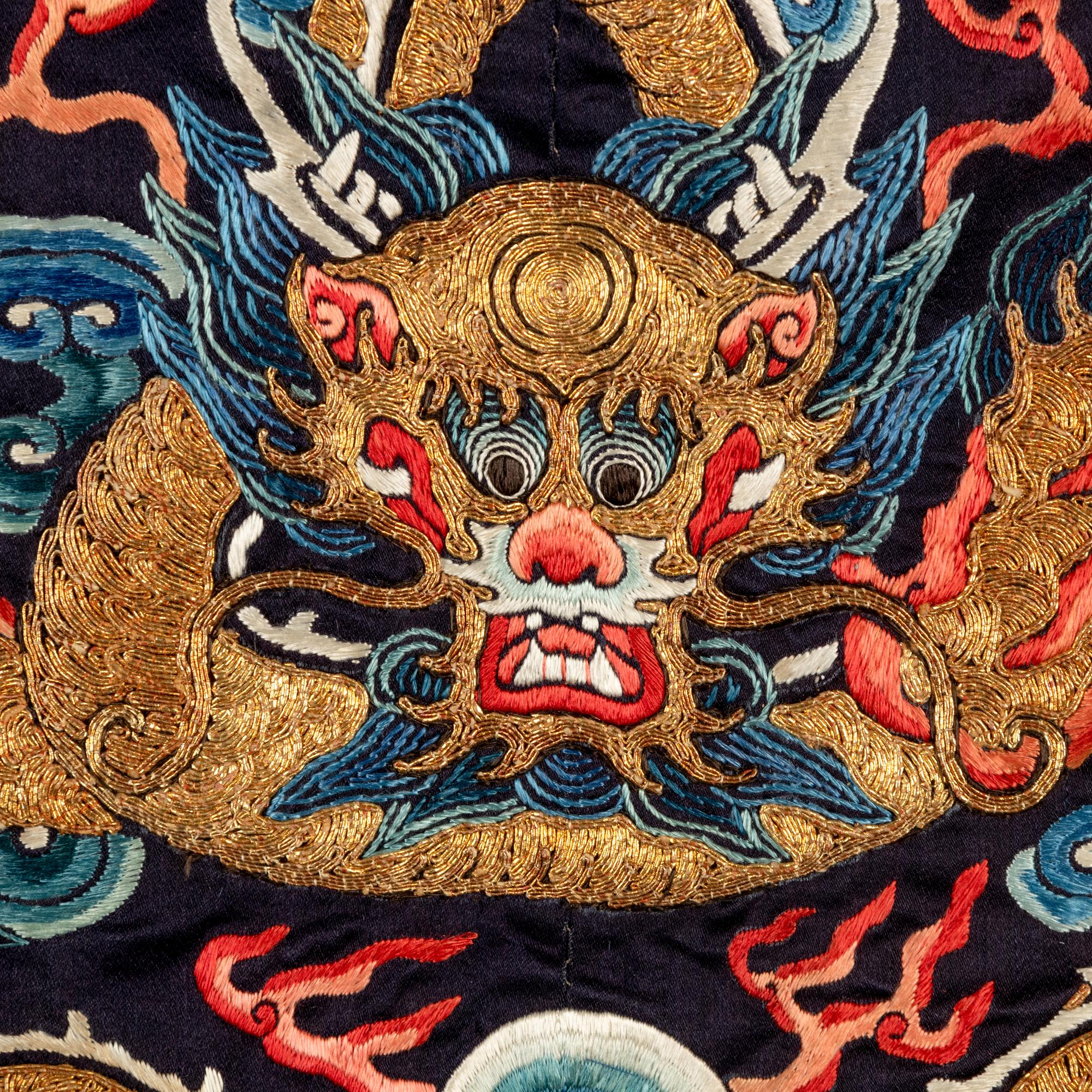 A Chinese Black Ground Embroidered Silk 'Dragon' Court Robe, Chaofugua, 19th Century 清晚期 黑緞地綉云龍紋朝服褂