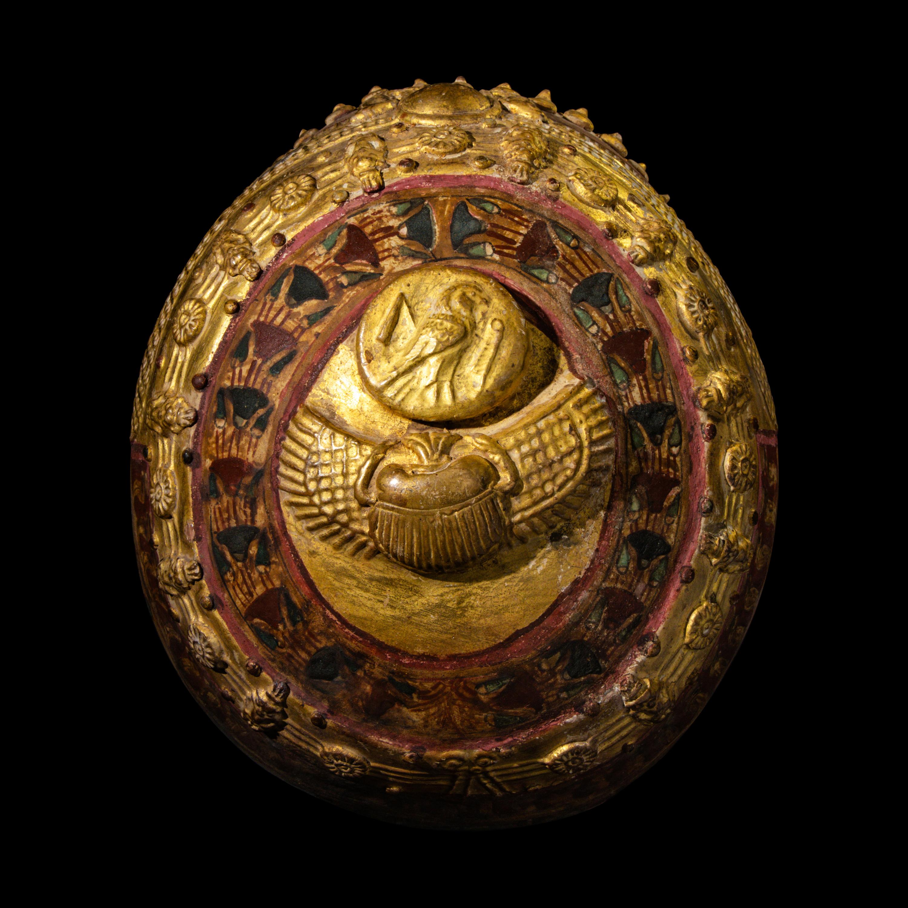 An Egyptian Gilt Cartonnage Mummy Mask of a Woman