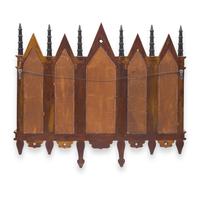 A Neogothic Style Ebonized and Parcel-Gilt Mirror
