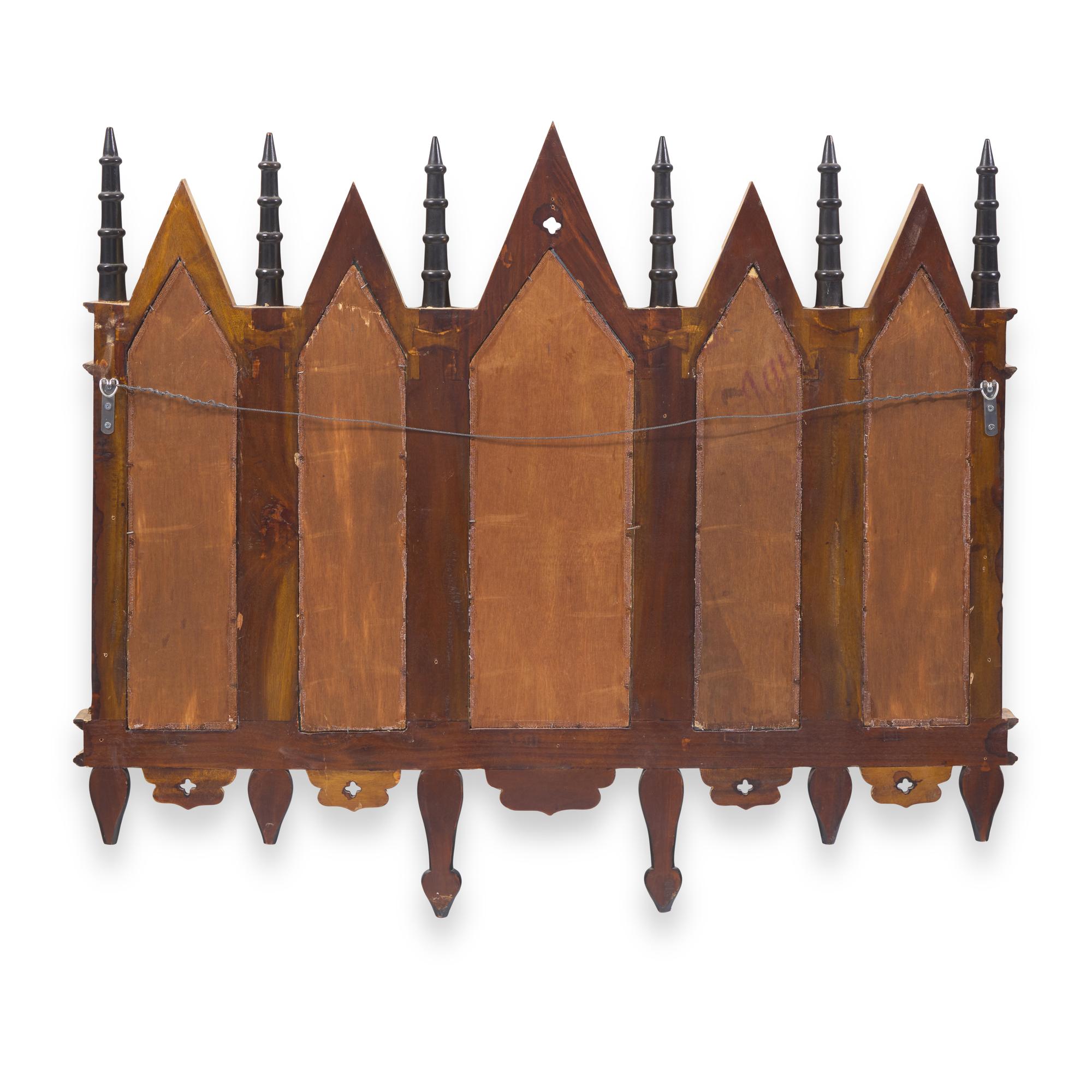 A Neogothic Style Ebonized and Parcel-Gilt Mirror