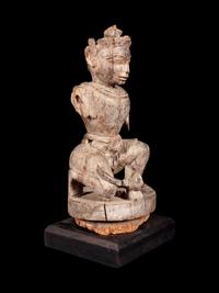 An Indian Carved Wood Figure of a Deity