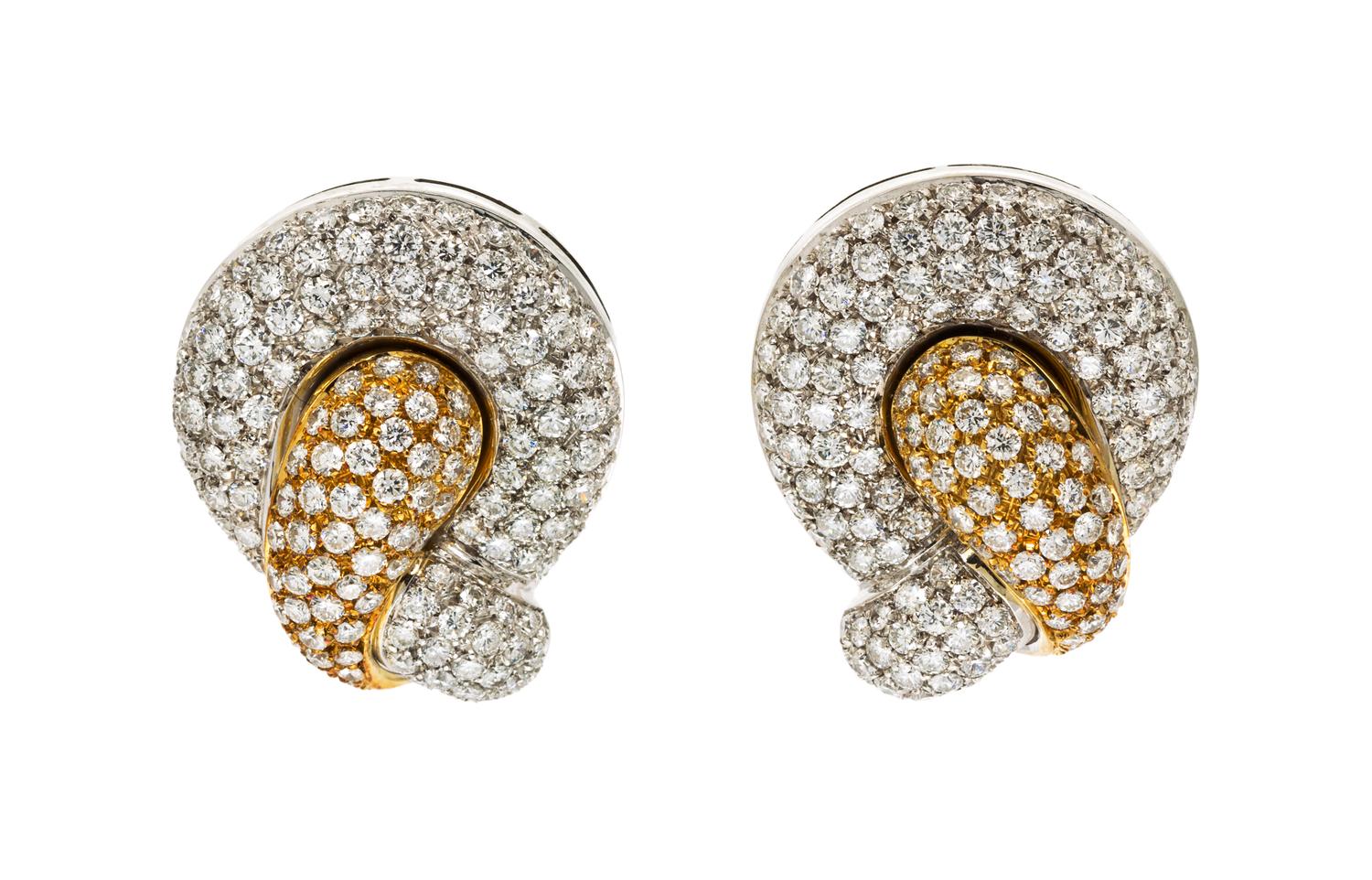 A Pair of 18 Karat Two Tone Gold and Diamond Pave Earclips, 19.10 dwts.