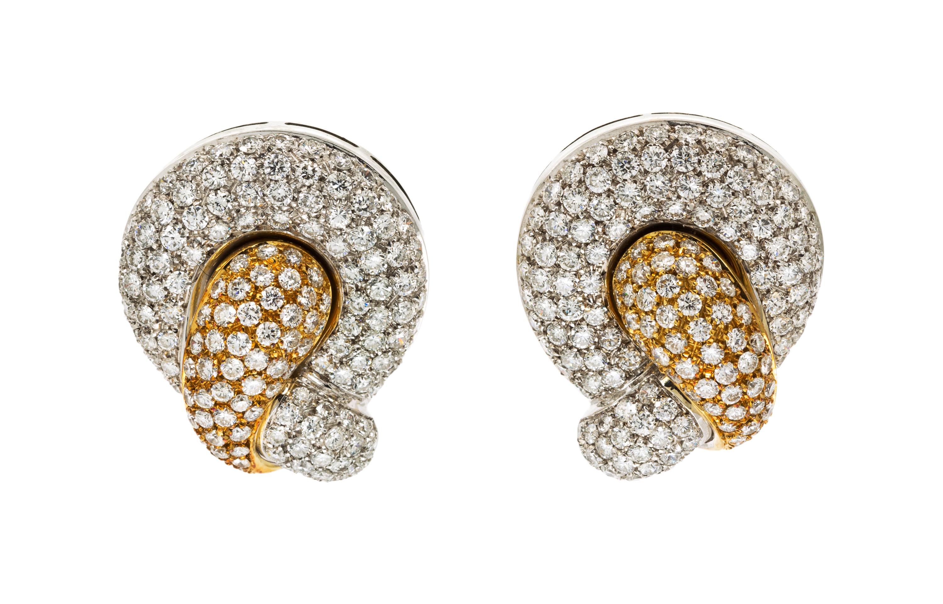 A Pair of 18 Karat Two Tone Gold and Diamond Pave Earclips, 19.10 dwts.