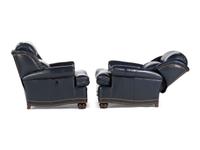 A Pair of Hancock and Moore Brass-Tacked Leather Chairs
