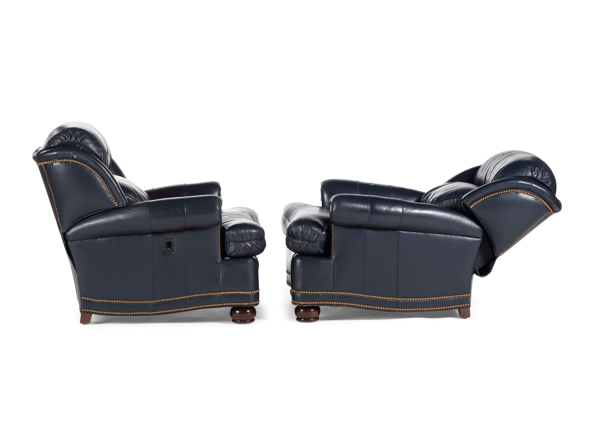 A Pair of Hancock and Moore Brass-Tacked Leather Chairs
