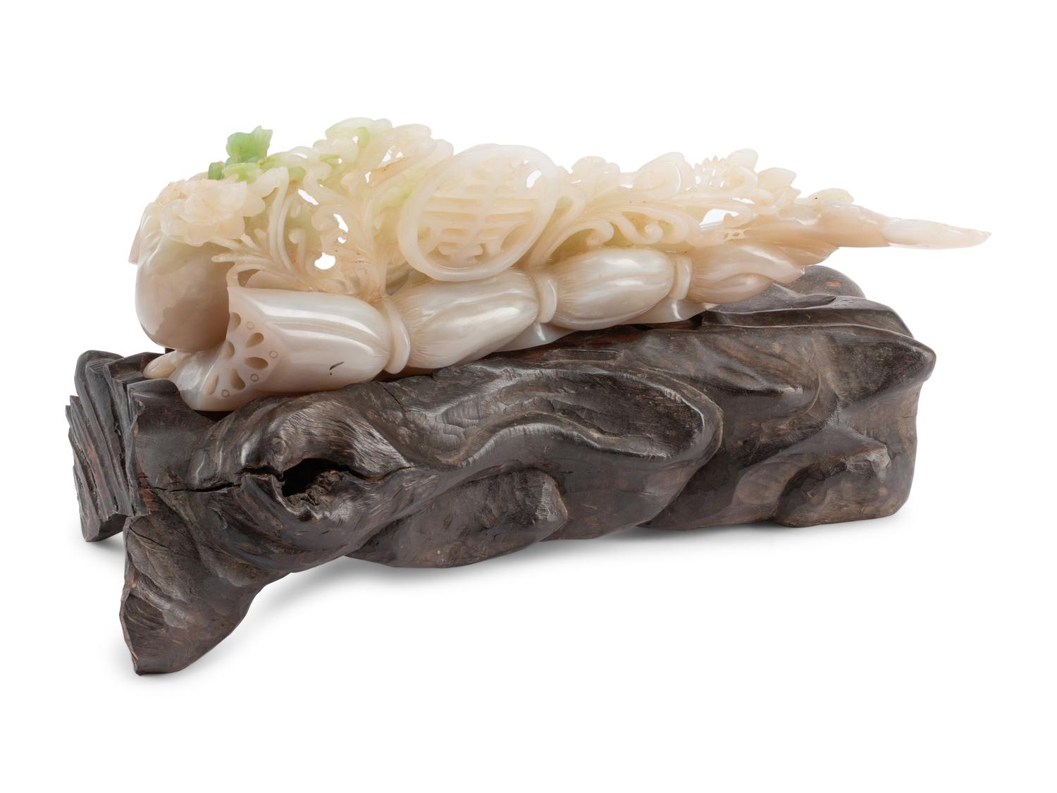 A Chinese Carved Hardstone Sculpture on a Wood Base