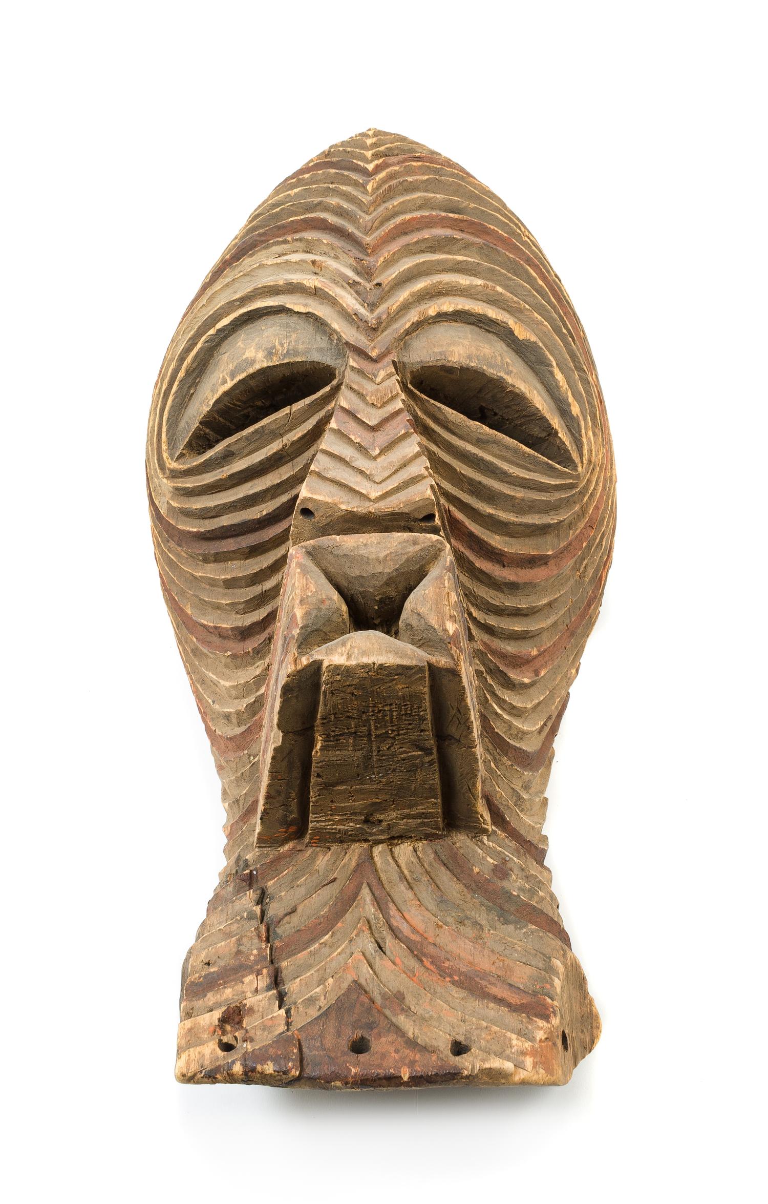 A Kifwebe Carved and Painted Wood Mask Height 20 1/2 inches. — 20TH CENTURY