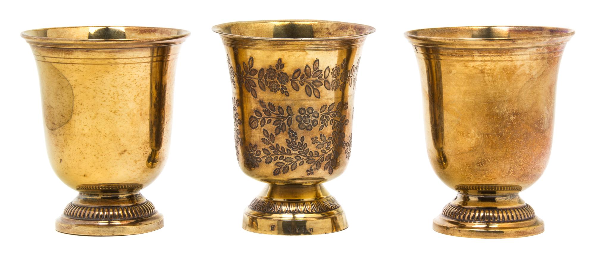 A Set of Three French Fine Vermeil Silver Beakers, Circa 1880, one having etched foliate decoration.