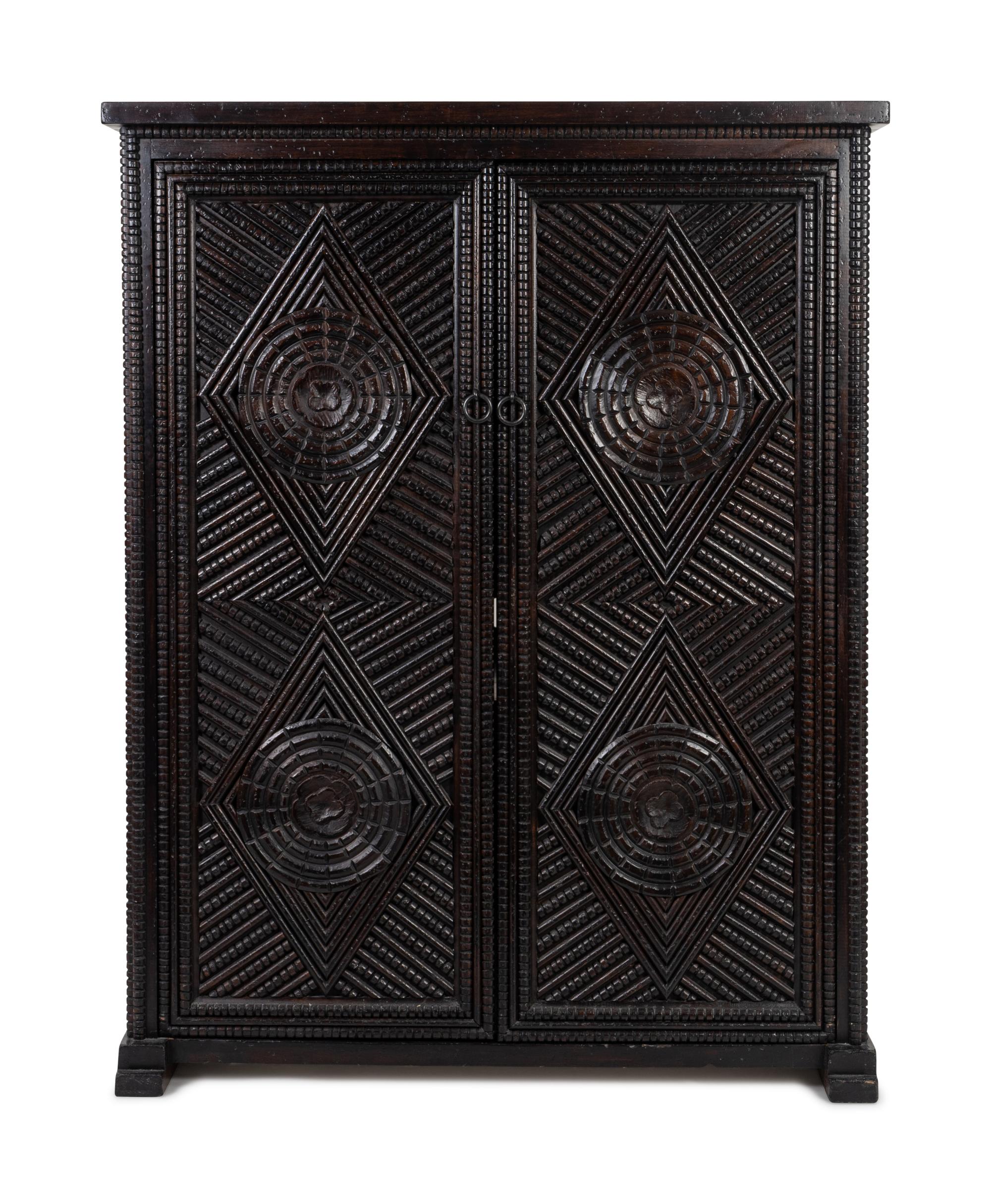 A Baroque Style Ebonized Wardrobe — 20TH CENTURY