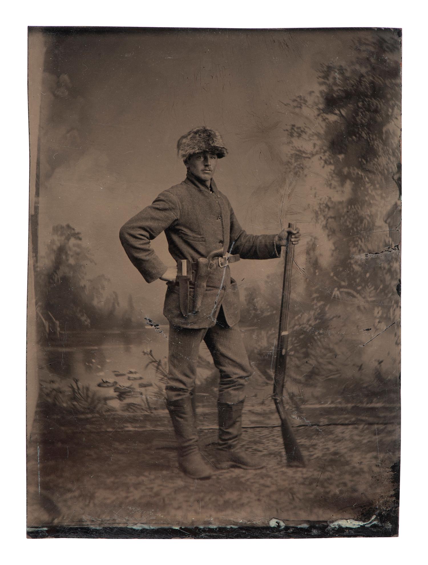 [WESTERN AMERICANA]. 3 tintypes of armed subjects, highlighted by possible buffalo hunter.