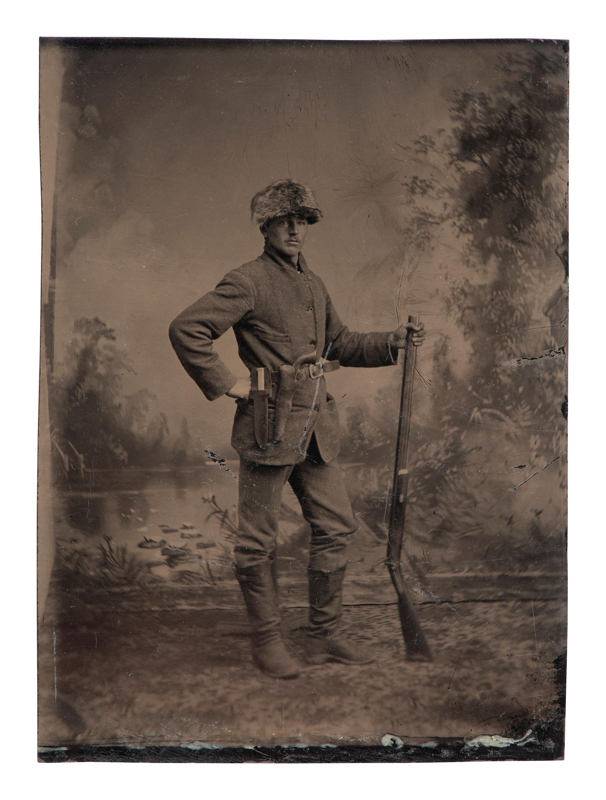 [WESTERN AMERICANA]. 3 tintypes of armed subjects, highlighted by possible buffalo hunter.