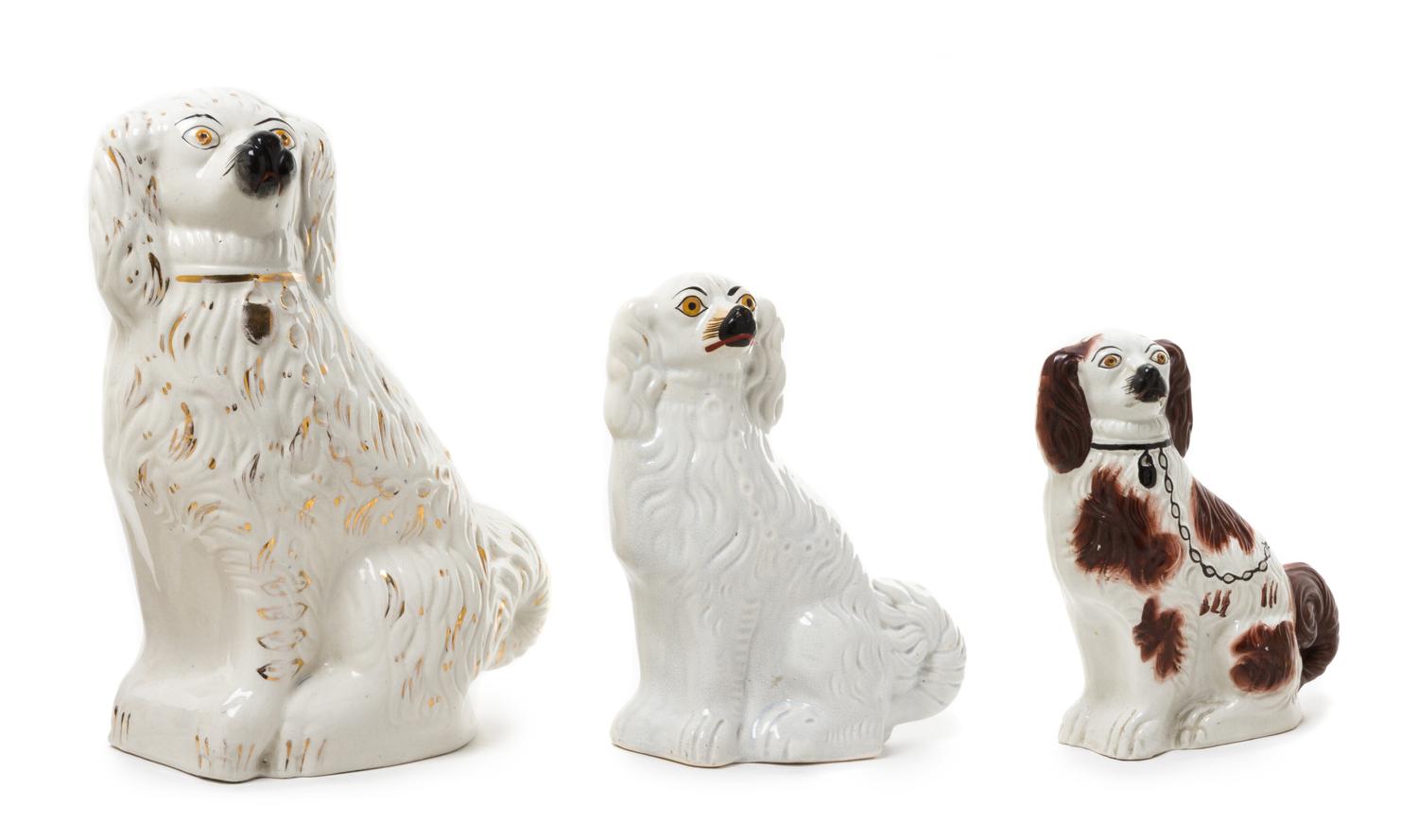 A Group of Three Staffordshire Dogs Height of tallest 15 1/2 inches.