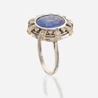 A sapphire, diamond, gold, and platinum ring