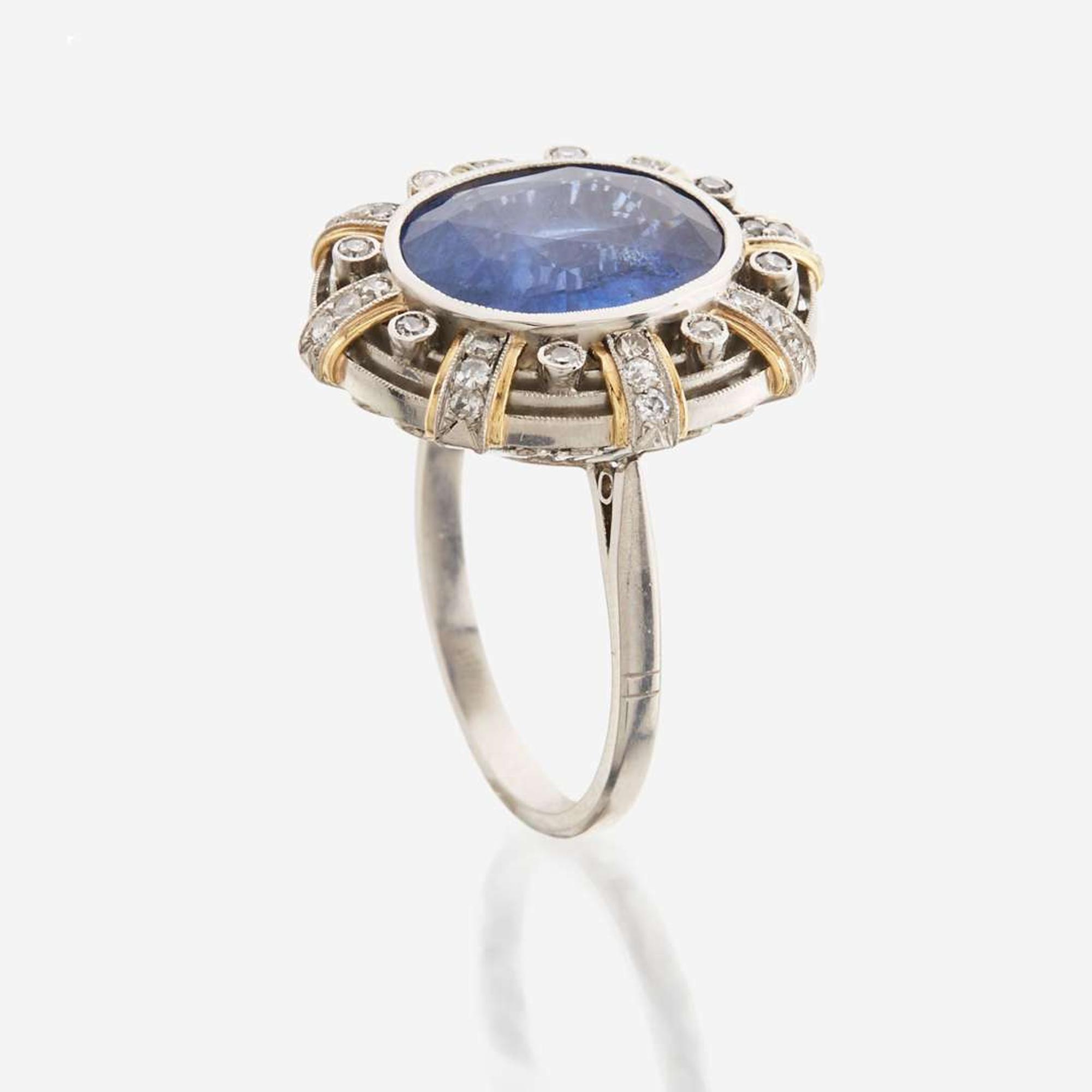 A sapphire, diamond, gold, and platinum ring