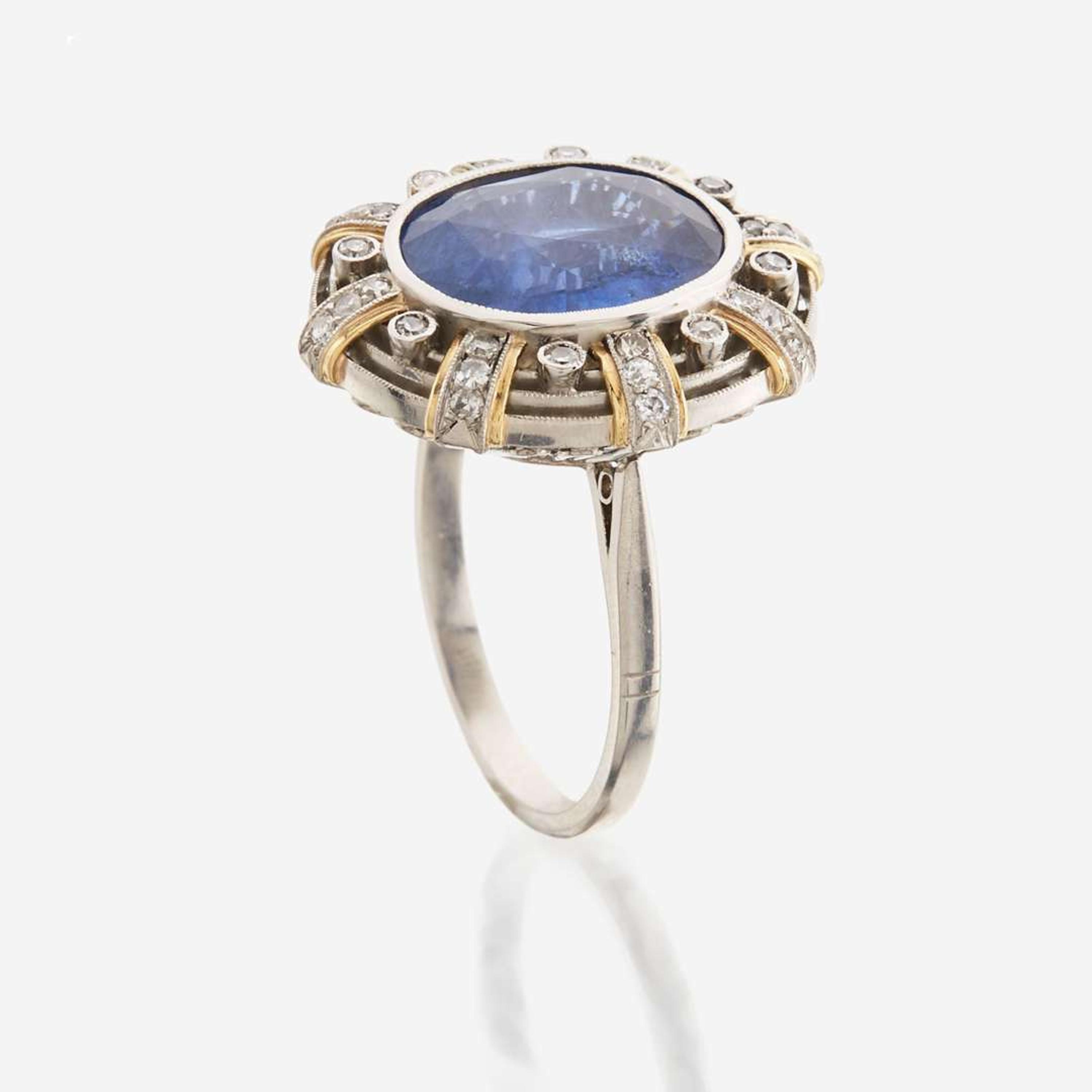 A sapphire, diamond, gold, and platinum ring