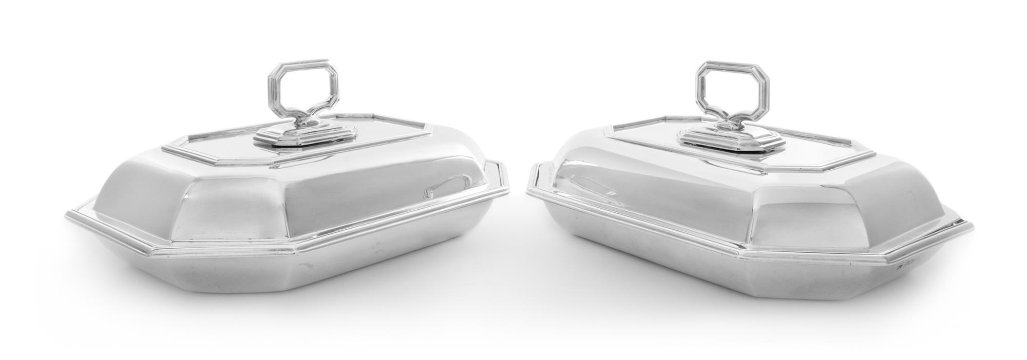 A Pair of Edwardian Silver Covered Entree Dishes, Sebastian Garrard, London, 1905, each of elongated octagonal form.