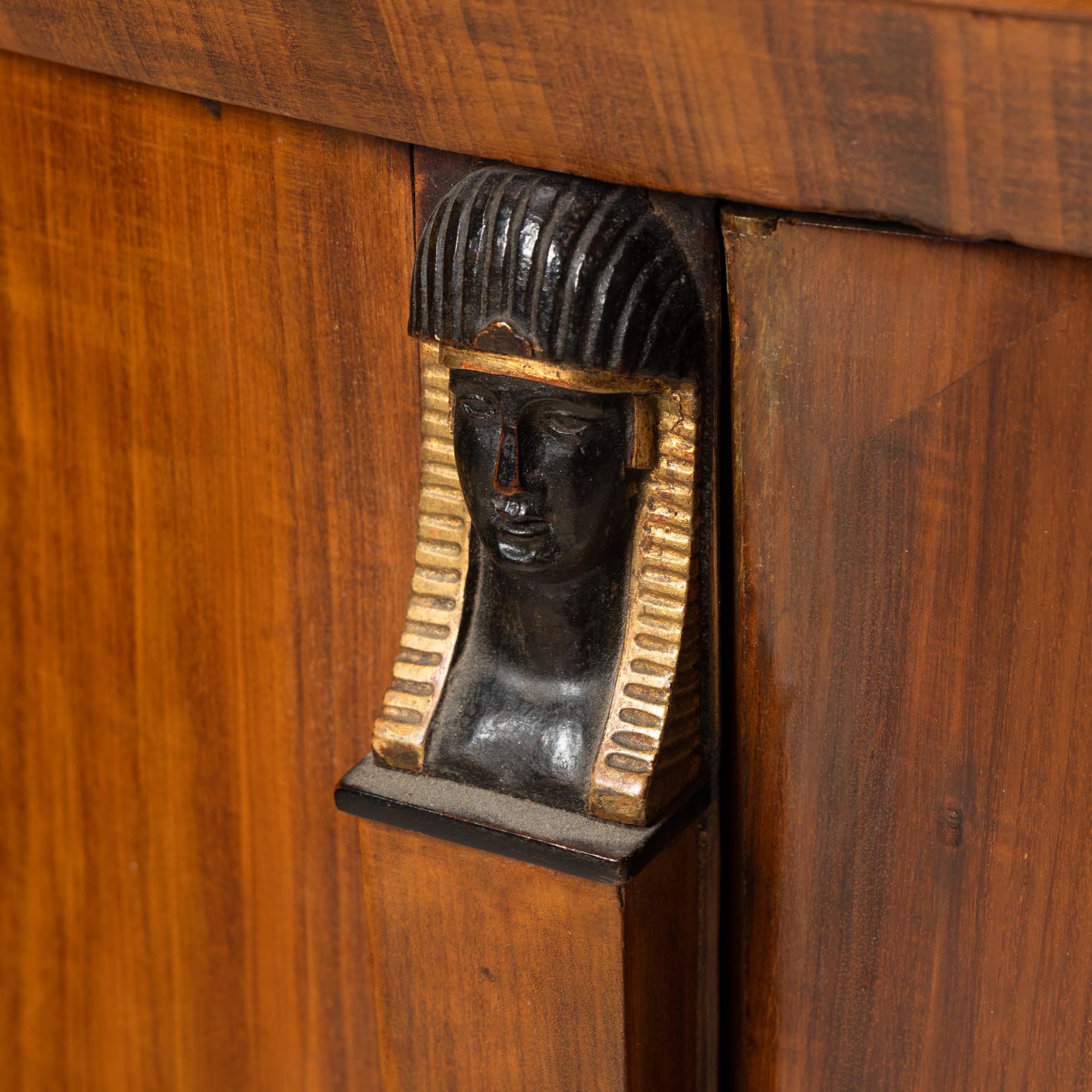 A German or Austrian Fruitwood, Part Ebonized and Parcel Gilt Marble Top Cabinet