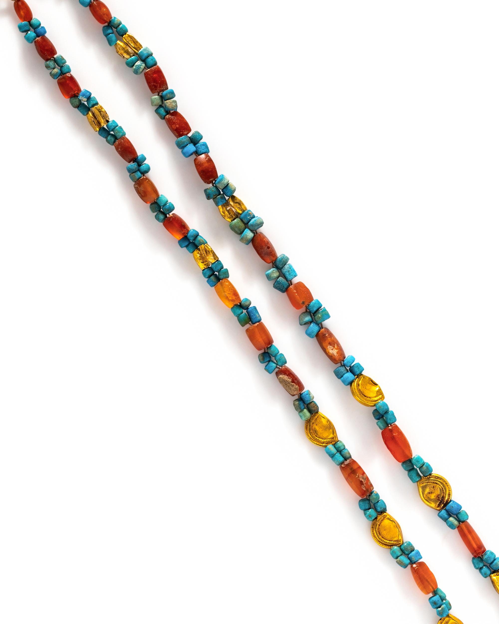 An Egyptian Gold and Carnelian Bead Necklace