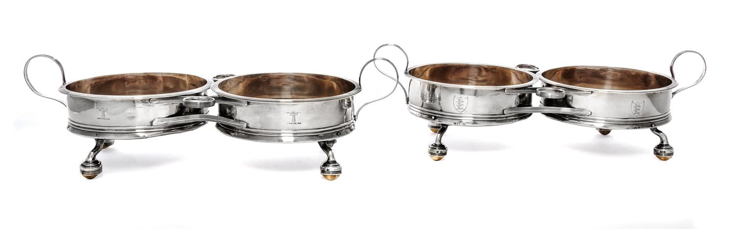 A Pair of George III Silver Two-Bottle Wine Trollies, Philip Bachelor, London, 1792, each with wood centers and raised on four feet wit