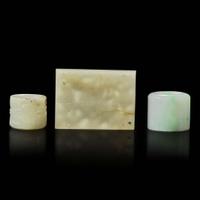 Two Chinese jade and jadeite thumb rings and a carved jade belt plaque 扳指及玉牌饰一组三件 Ming to Qing dynasty ???