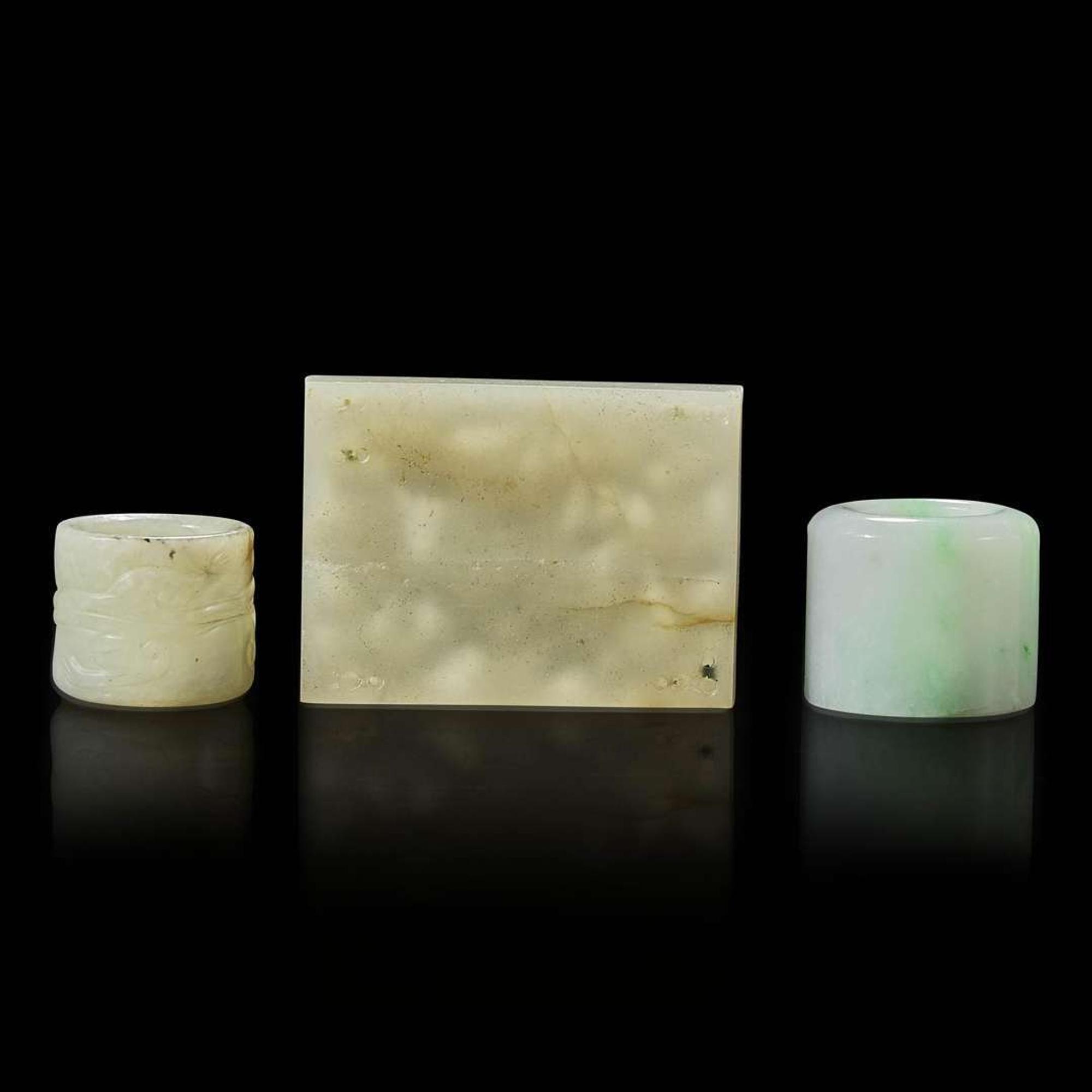 Two Chinese jade and jadeite thumb rings and a carved jade belt plaque 扳指及玉牌饰一组三件 Ming to Qing dynasty ???