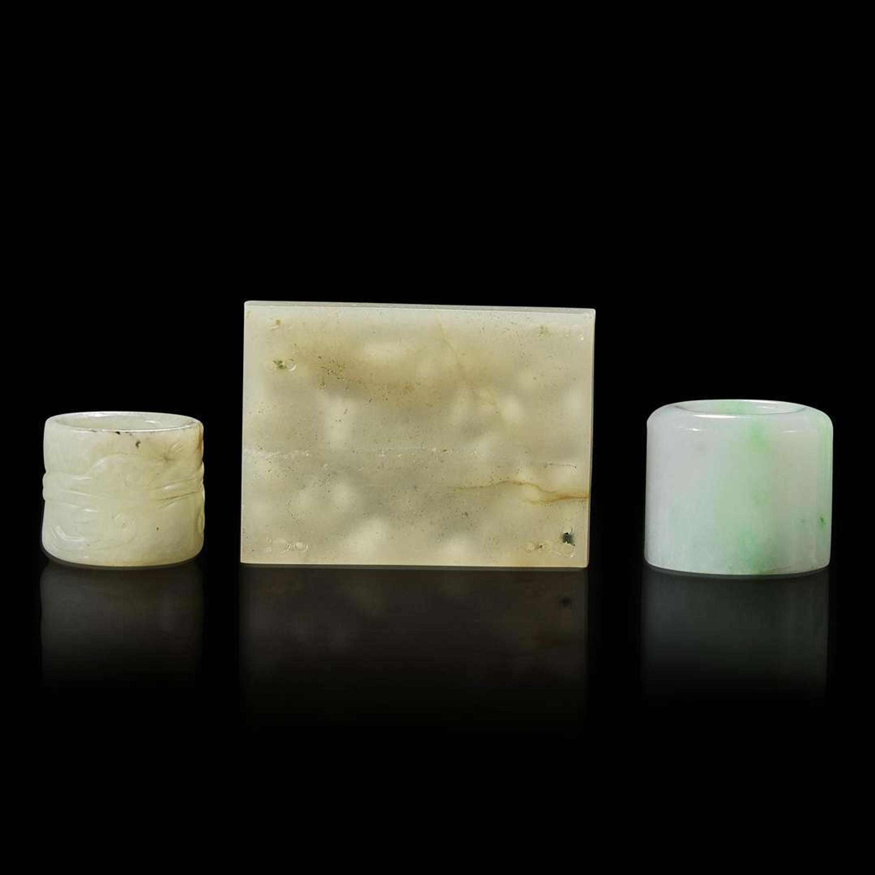 Two Chinese jade and jadeite thumb rings and a carved jade belt plaque 扳指及玉牌饰一组三件 Ming to Qing dynasty ???