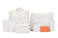 Six Goyard Items: Two Totes, Three Pouches, and One Wallet