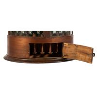 A Merrick's Six Cord Cylindrical Spool Cabinet