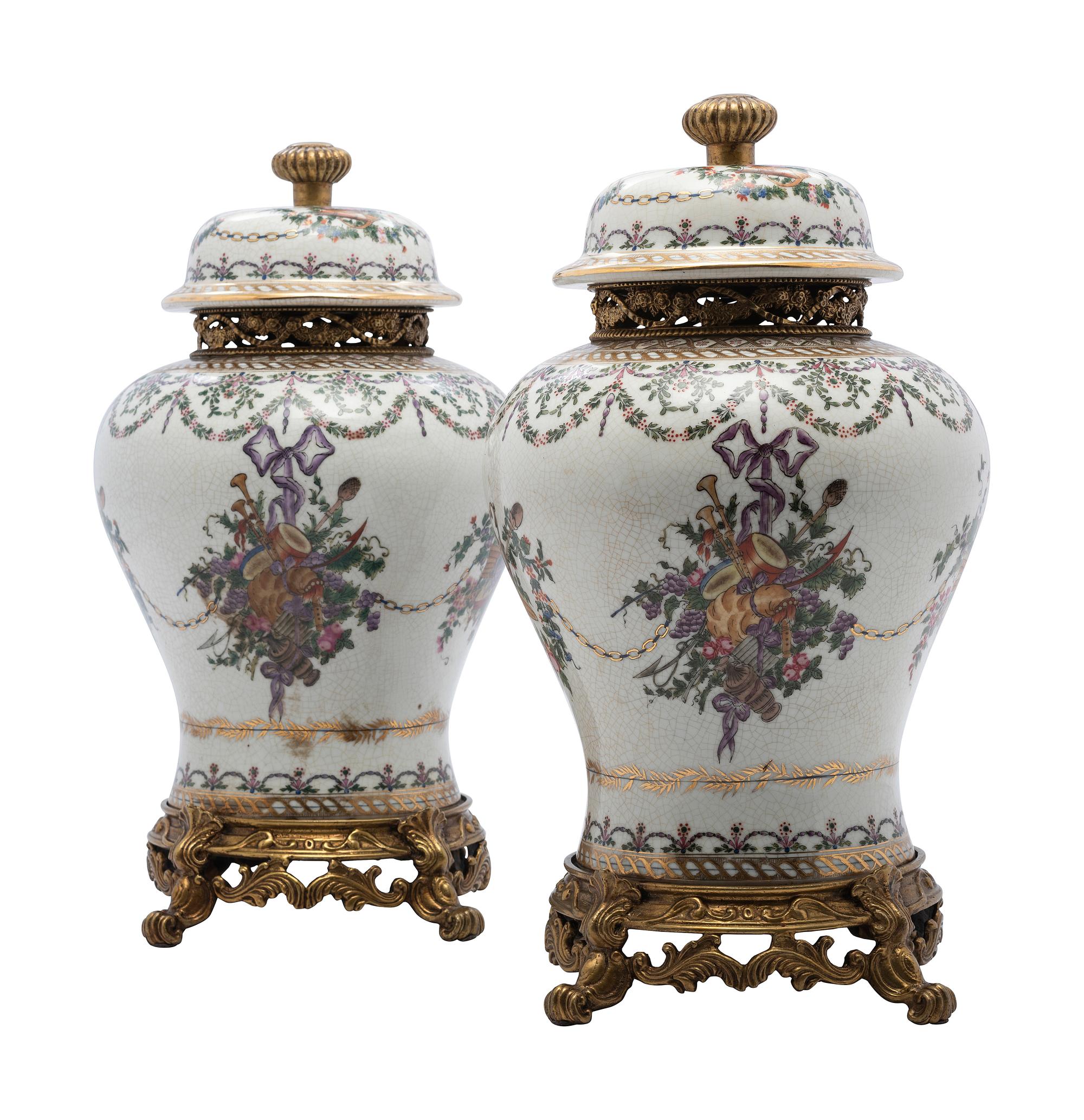 A Pair of United Wilson Gilt Metal Mounted Porcelain Urns