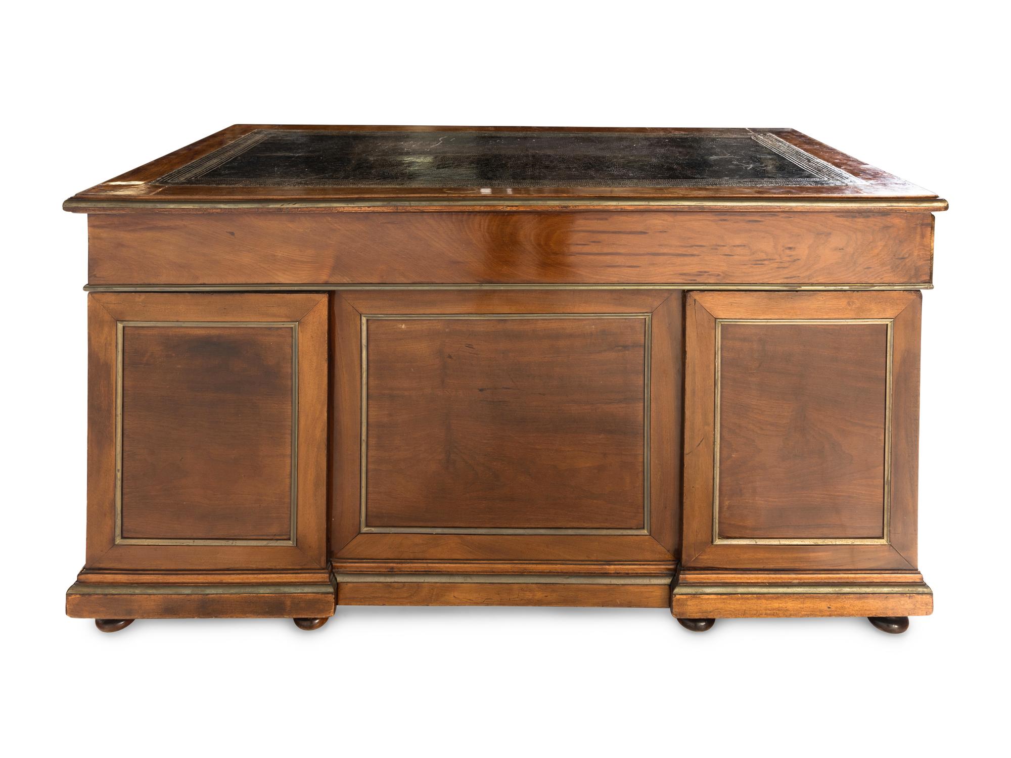 A Directoire Style Brass Mounted Mahogany Pedestal Desk