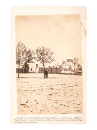 [CIVIL WAR]. BRADY, Mathew. CDV of man possibly wearing a frock coat at military barracks. Washington, D.C., 1862.
