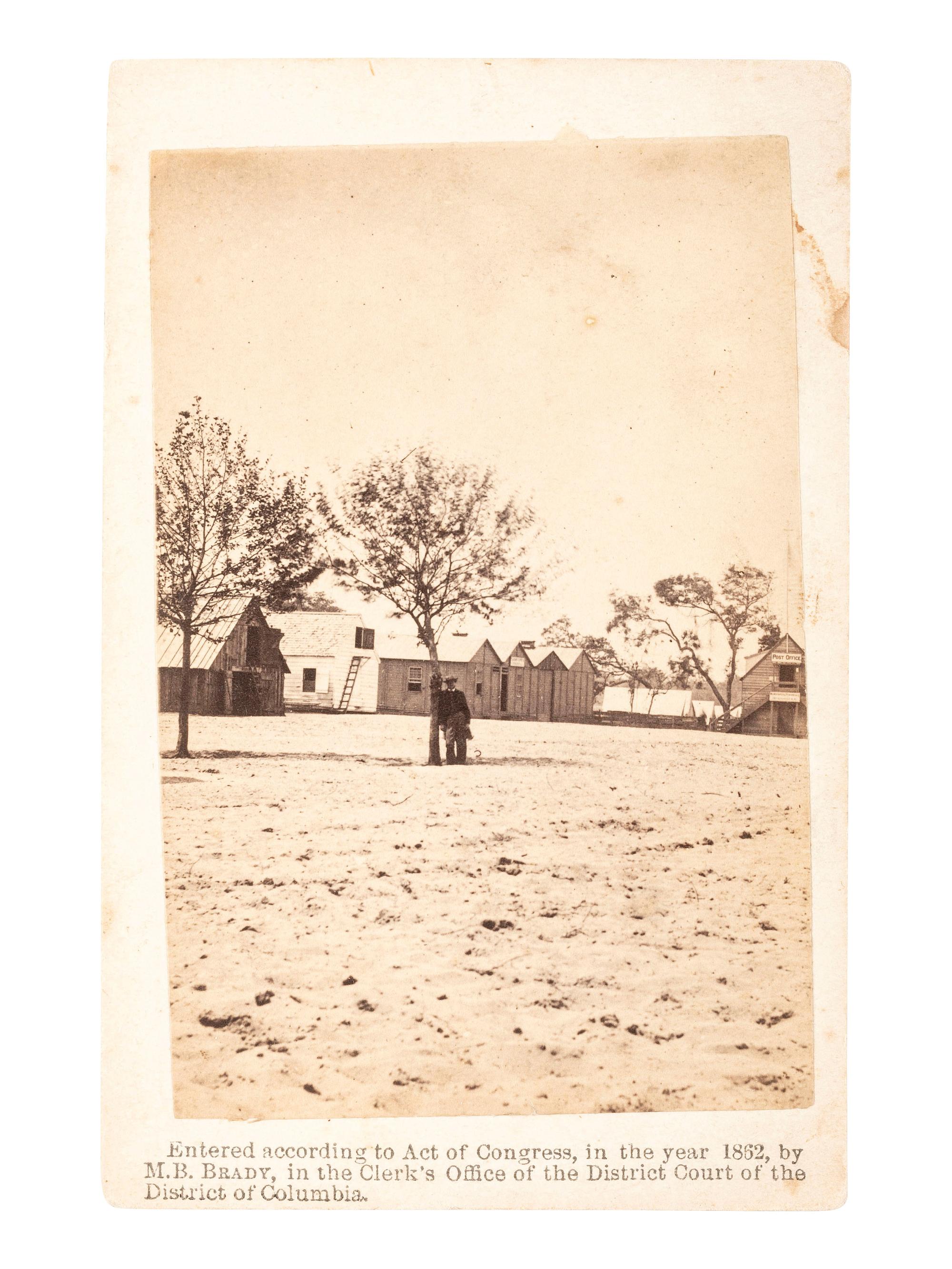 [CIVIL WAR]. BRADY, Mathew. CDV of man possibly wearing a frock coat at military barracks. Washington, D.C., 1862.