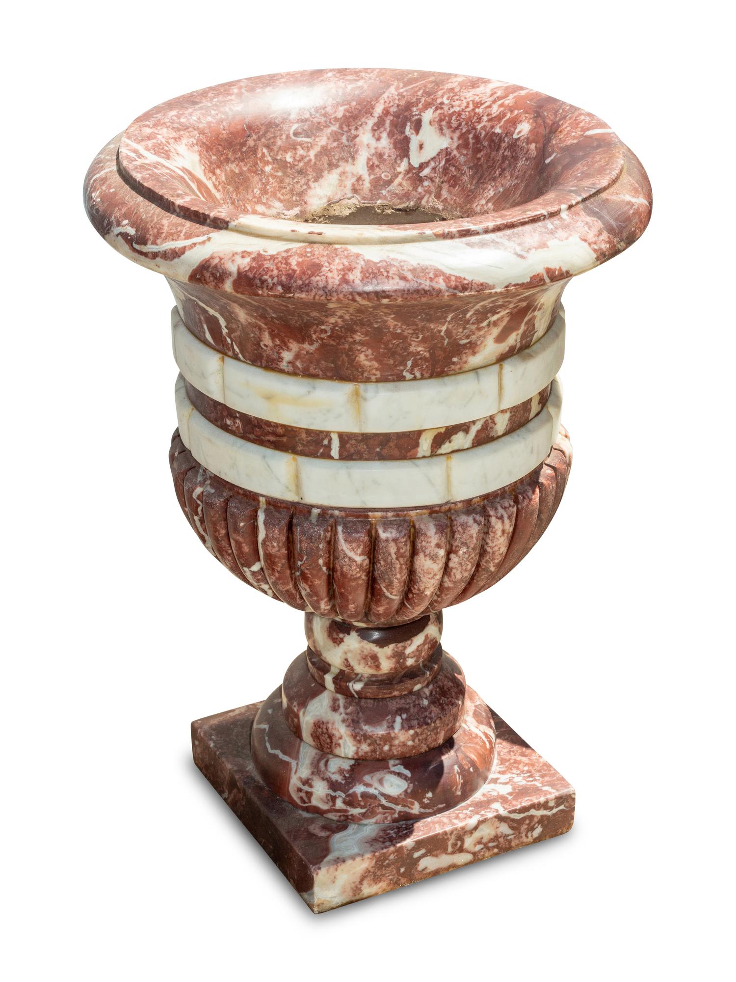A Set of Four Italian Carved Red and White Marble Urns