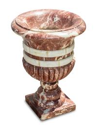 A Set of Four Italian Carved Red and White Marble Urns