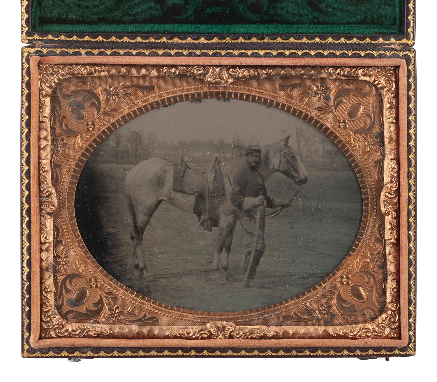 [CIVIL WAR]. Quarter plate tintype featuring a Union cavalryman with his horse.