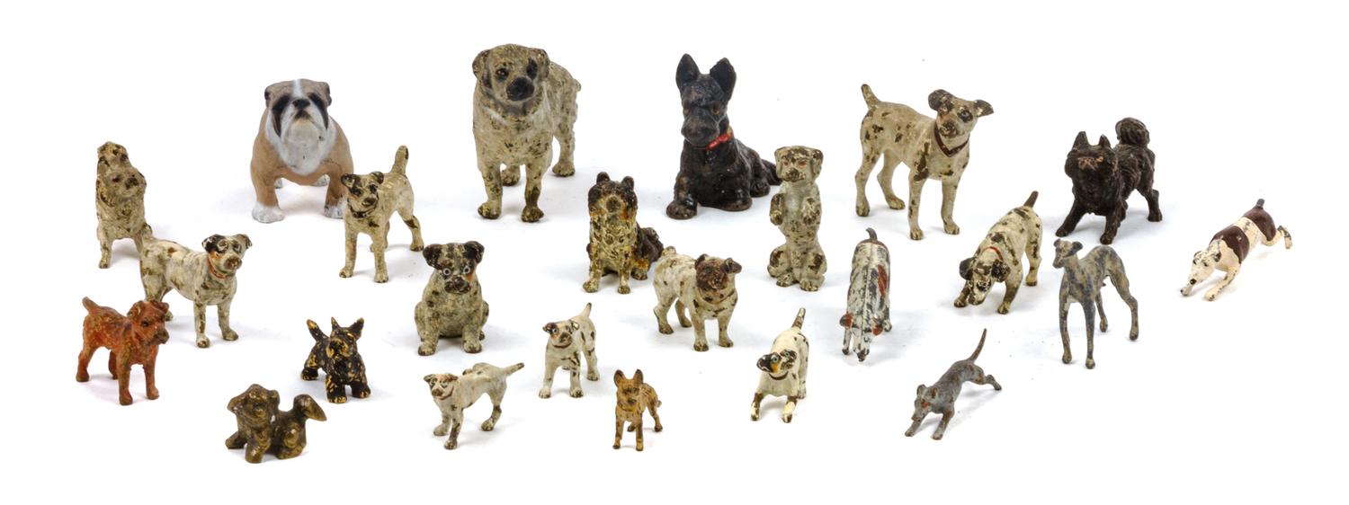 A Group of Twenty-Four Painted Bronzes depicting Various Dog Breeds Width of widest 2 3/4 inches.