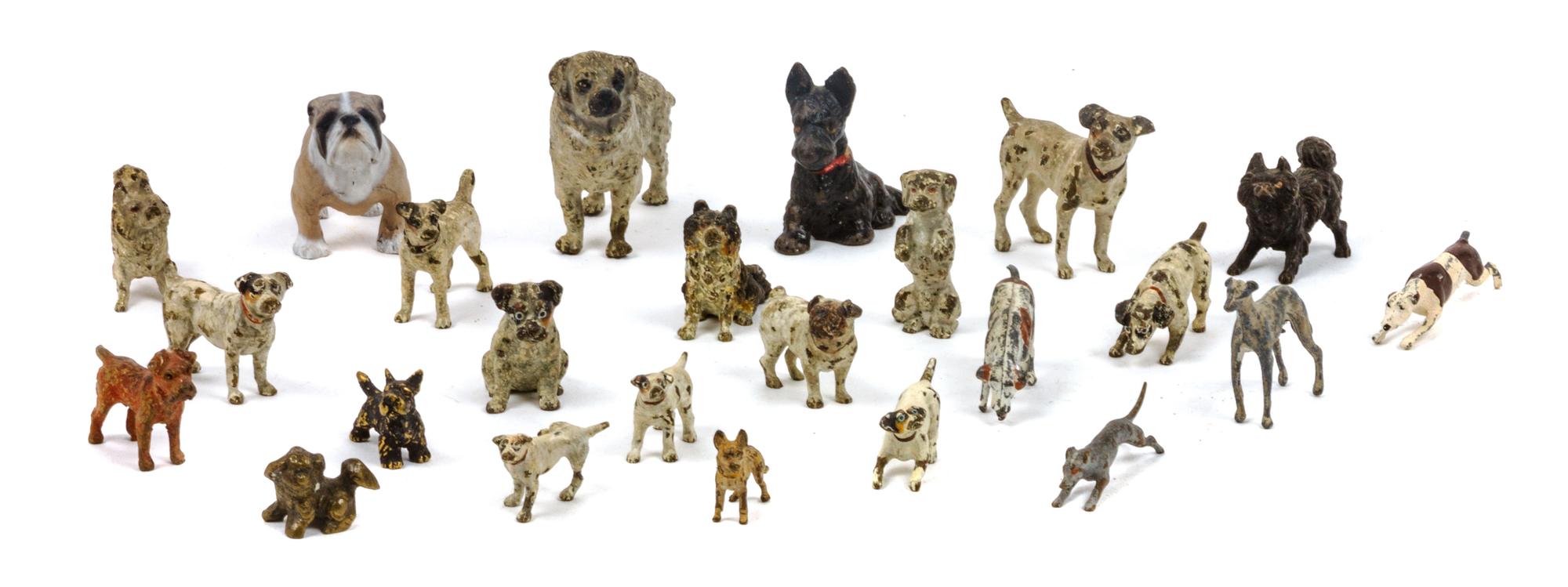 A Group of Twenty-Four Painted Bronzes depicting Various Dog Breeds Width of widest 2 3/4 inches.