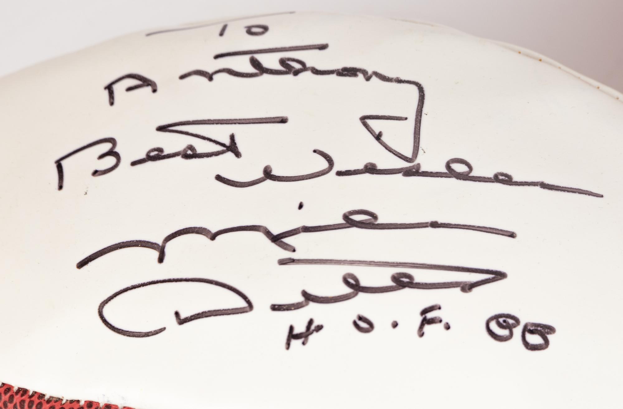 A Group Mike Ditka’s Restaurant Gift Shop Items Including Autograph Model Footballs Signed by Mike Ditka