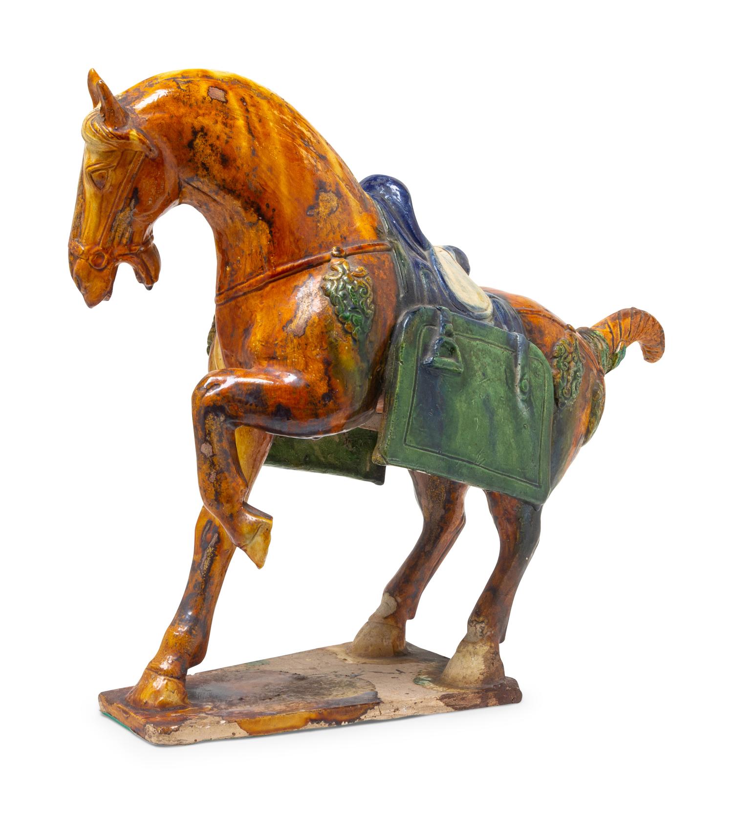 A Chinese Sancai Glazed Pottery Figure of a Horse