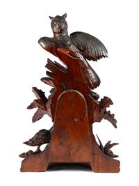 A Swiss "Black Forest" Carved Wood Clock