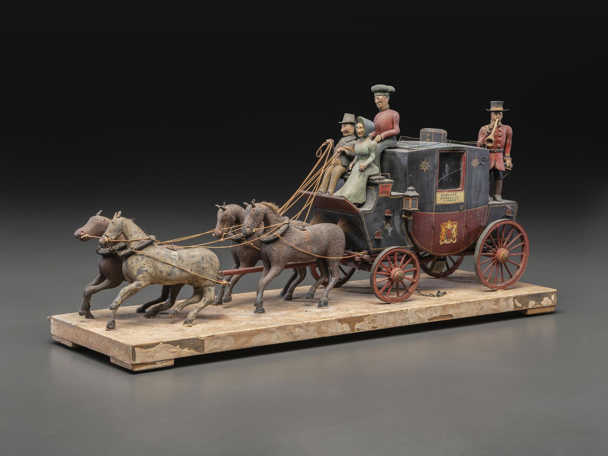 A Folk Art Carved and Painted Wood English Royal Stagecoach