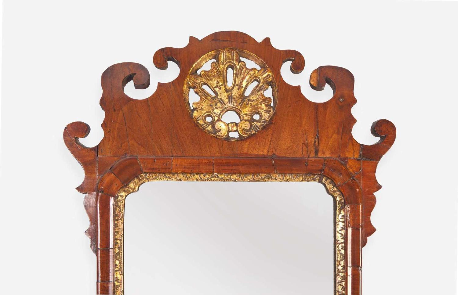 A small Chippendale fret-carved burl walnut and parcel-gilt looking glass, second half 18th century